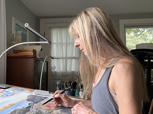 michelle constantine working on a watercolor painting